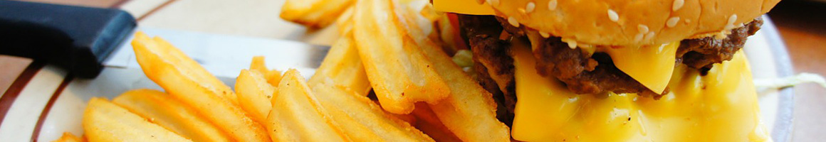 Eating Burger Hot Dog at Damburger restaurant in Redding, CA.